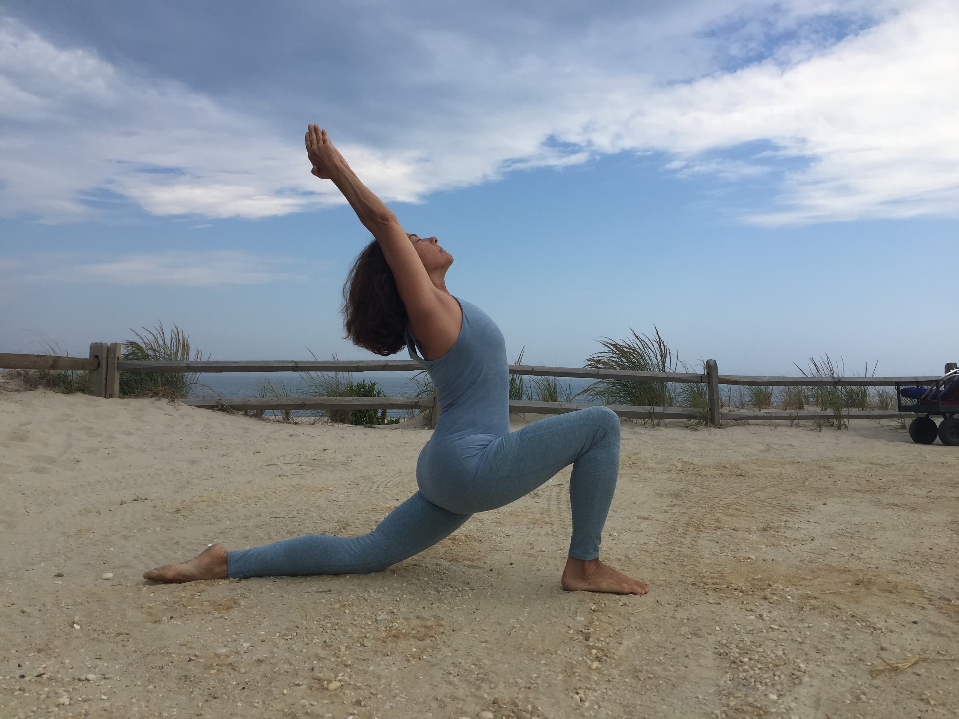 Cynthia Tarantino practicing yoga on the beach at Long Beach Island